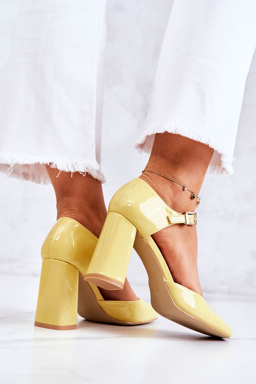 Fashionable Lacquered Pumps On A Bar Yellow Maoris