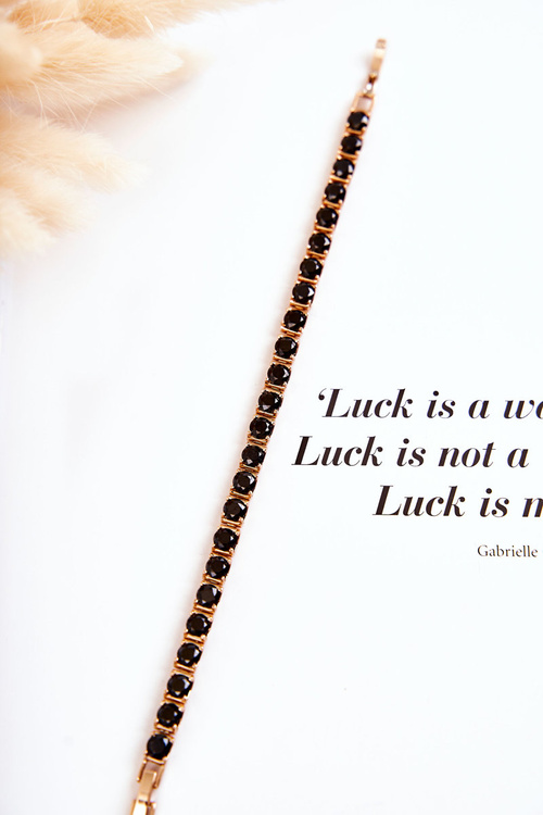 An elegant bracelet with a clasp in black and gold