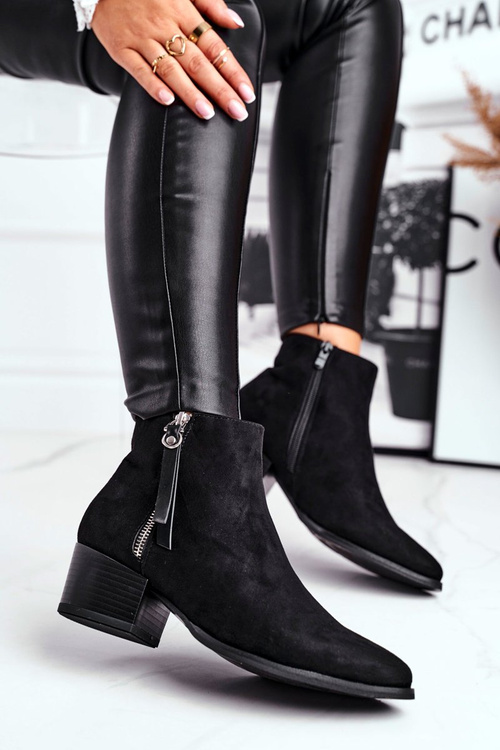 Women’s boots on high heel warm black Discretely