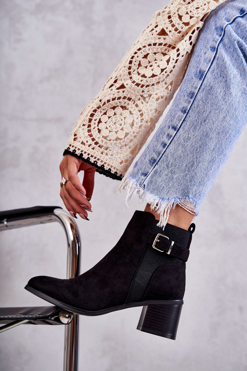 Suede boots on a post Black Vannes