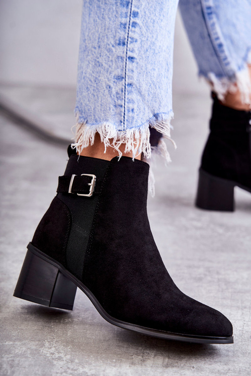 Suede boots on a post Black Vannes