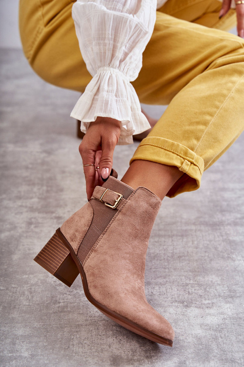 Suede boots on a post Brown Vannes