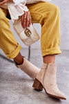 Suede boots on a post Beige Vannes