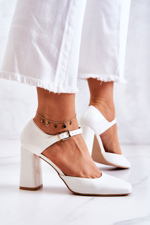 Fashionable Lacquered Pumps On A Bar White Maoris