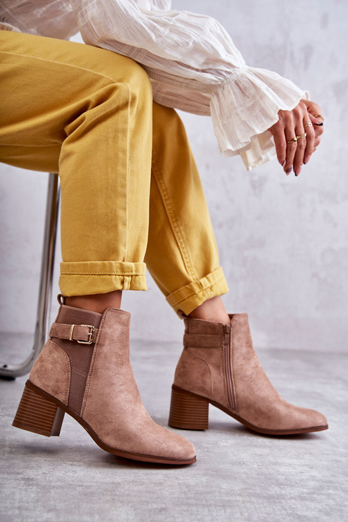 Suede boots on a post Brown Vannes