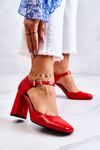 Fashionable Lacquered Pumps On A Bar Red Maoris