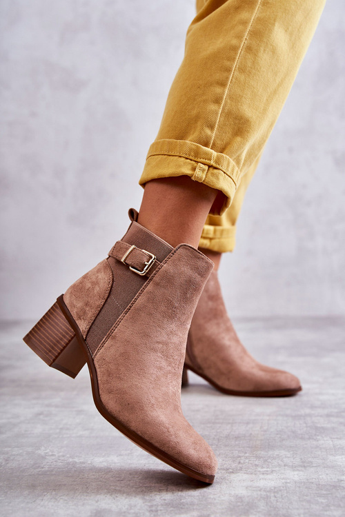 Suede boots on a post Brown Vannes