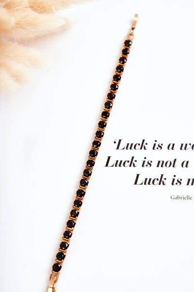 An elegant bracelet with a clasp in black and gold