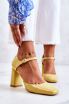 Fashionable Lacquered Pumps On A Bar Yellow Maoris