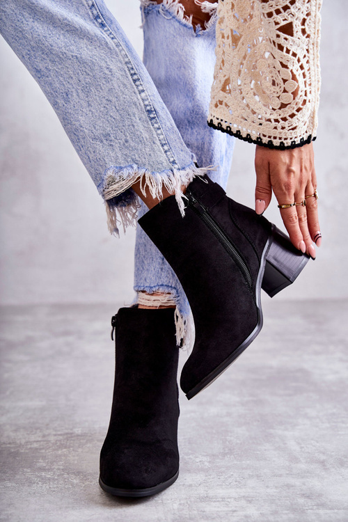 Suede boots on a post Black Vannes