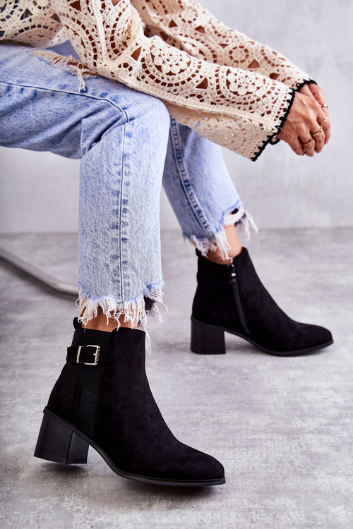 Suede boots on a post Black Vannes