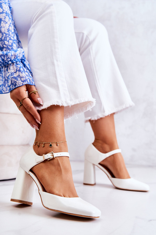 Fashionable Lacquered Pumps On A Bar White Maoris