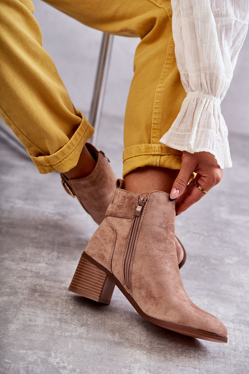 Suede boots on a post Brown Vannes