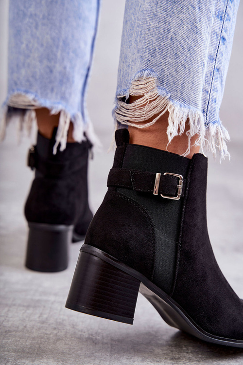 Suede boots on a post Black Vannes