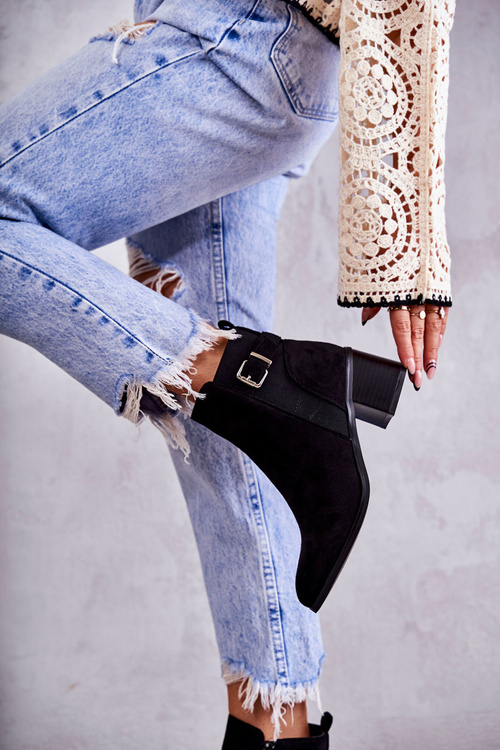 Suede boots on a post Black Vannes