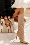 Classic Suede Black Boots On A Beige Ameya