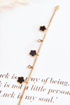 Bracelet on a chain with flowers gold-black