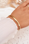 Smooth bracelet made of gold-colored surgical steel