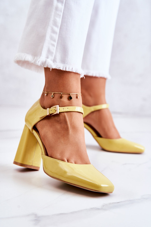 Fashionable Lacquered Pumps On A Bar Yellow Maoris