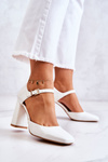 Fashionable Lacquered Pumps On A Bar White Maoris