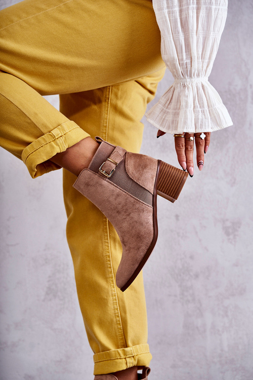 Suede boots on a post Brown Vannes